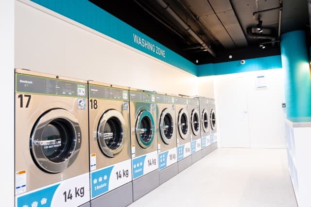 Row of 14kg Spakleen washing machines in the washing zone at the Werribee laundromat